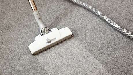 carpet being cleaned with vacuum